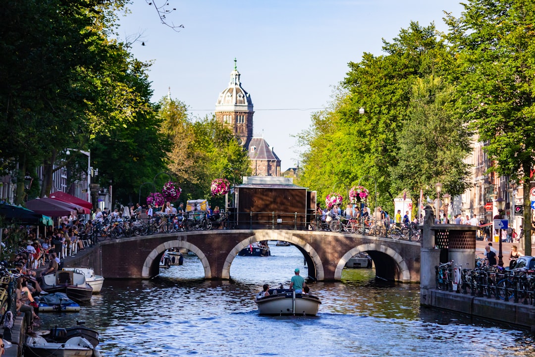 Amsterdam canal bridge (Photo via Unsplash)